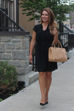 stylish woman with a natural cork purse made in portugal 